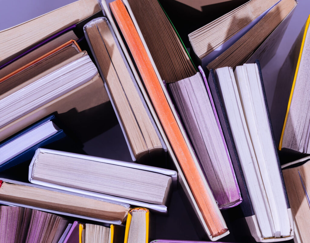 top view of scattered stack of books on table